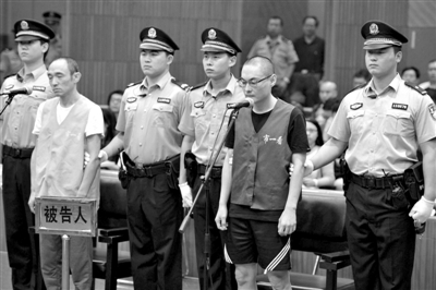 庭审中，嫌疑人李明被检方以窝藏罪指控。新华社记者 公磊 摄